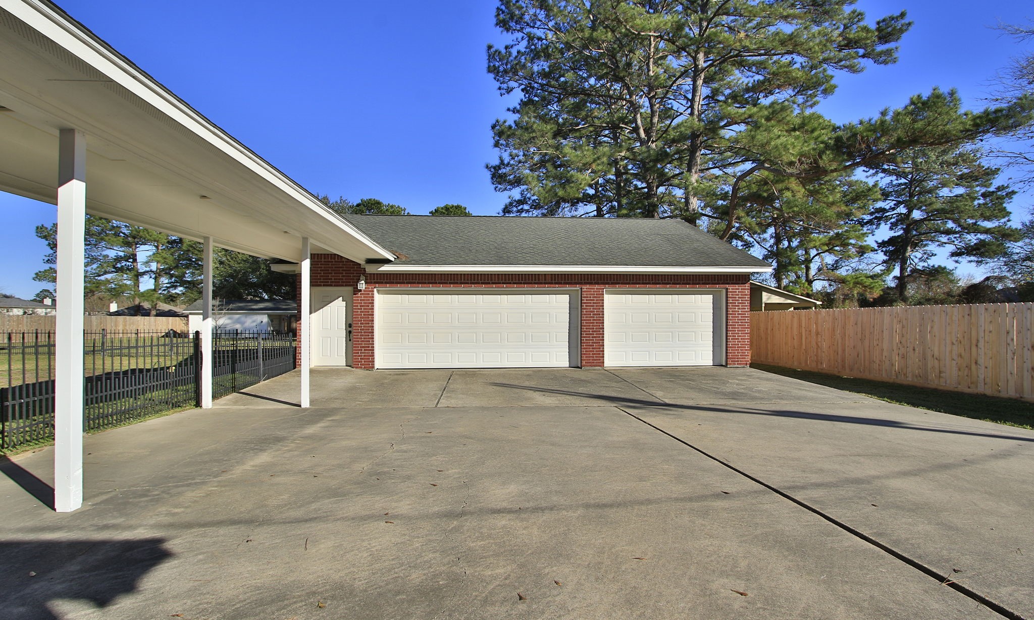30610 Quinn Road Tomball, TX 77375 - Photo 2 of 50 Coverd porch from the home to the 34' x 34' 3 car garage.