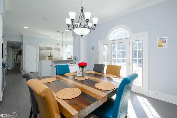 a bathroom with a sink mirror and a window