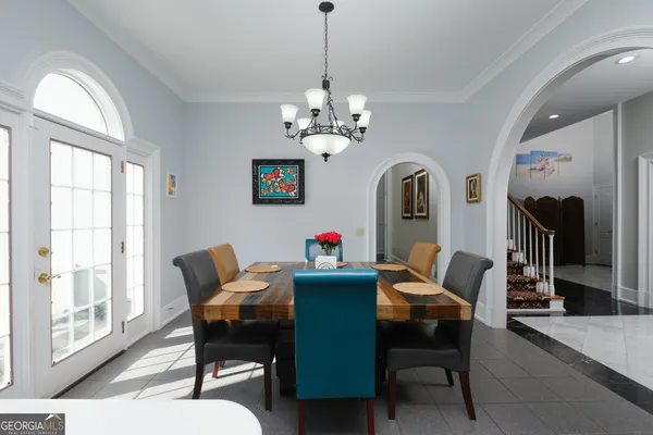 a bedroom with a bed couch and a window