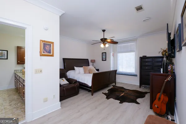 a view of a patio with table and chairs and wooden floor