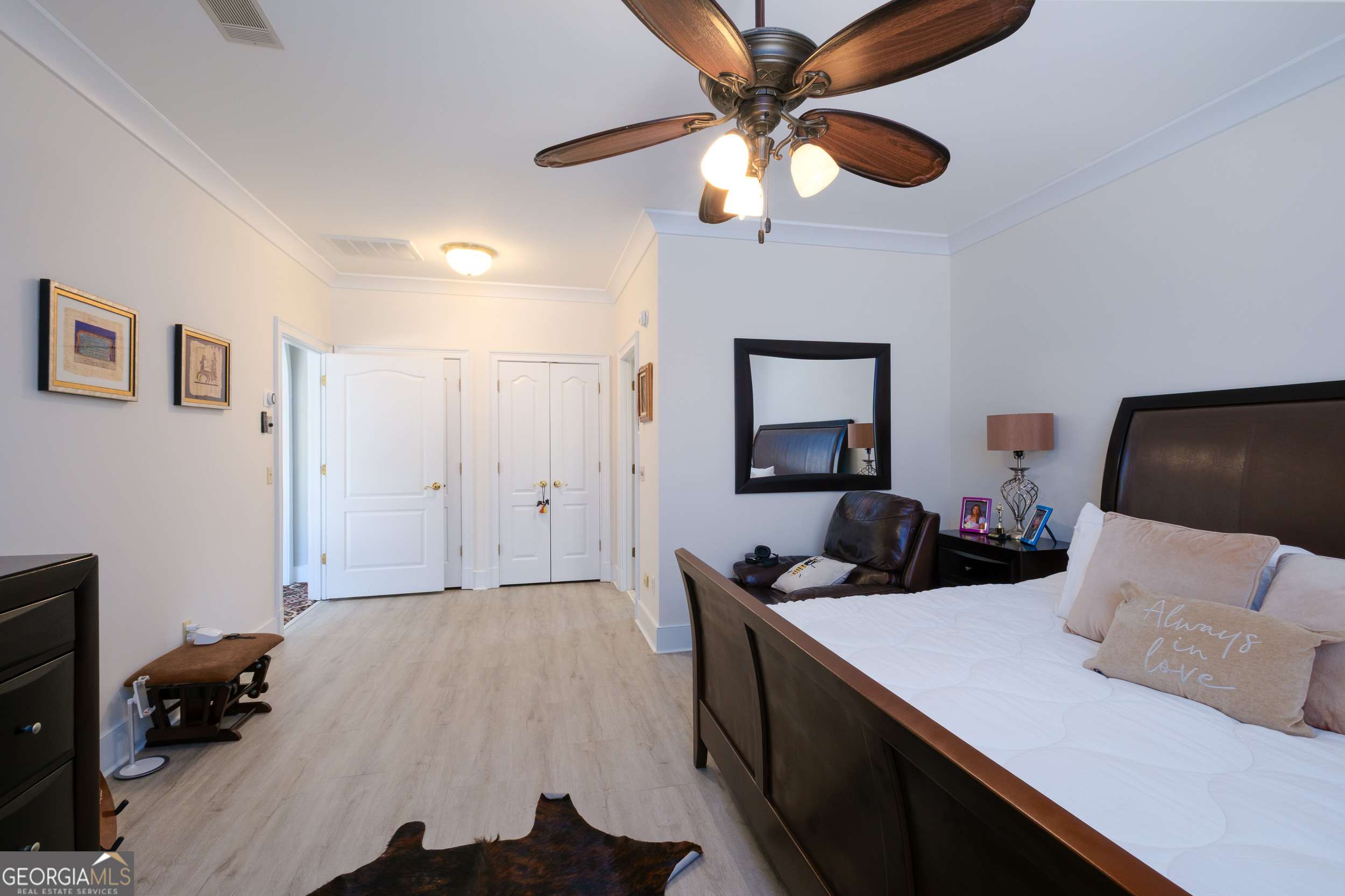 1900 Country Club Road Statesboro, GA 30458 - Photo 31 of 80 a bedroom with a bed and a chandelier