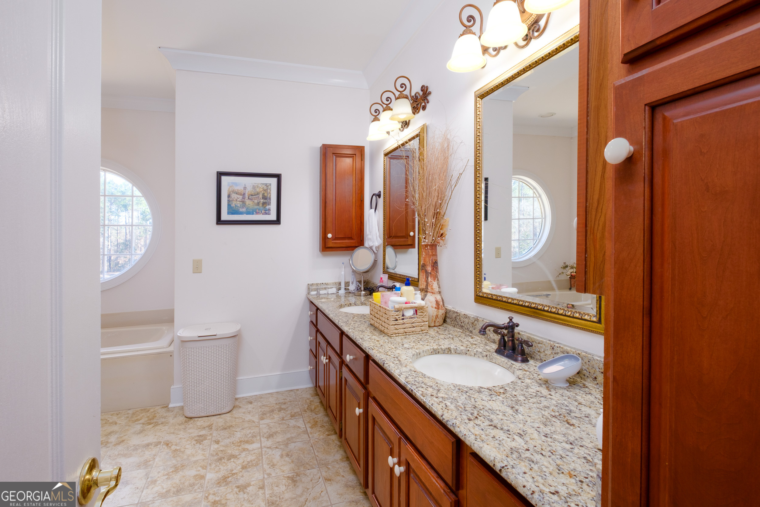 1900 Country Club Road Statesboro, GA 30458 - Photo 32 of 80 a bathroom with a granite countertop sink and a mirror