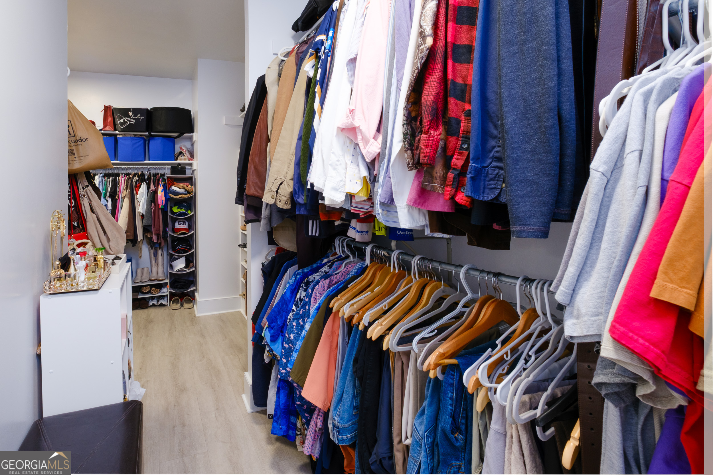 1900 Country Club Road Statesboro, GA 30458 - Photo 35 of 80 a view of walk in closet with clothes and shoes