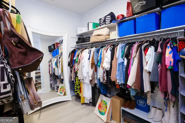 a view of a patio with table and chairs potted plants