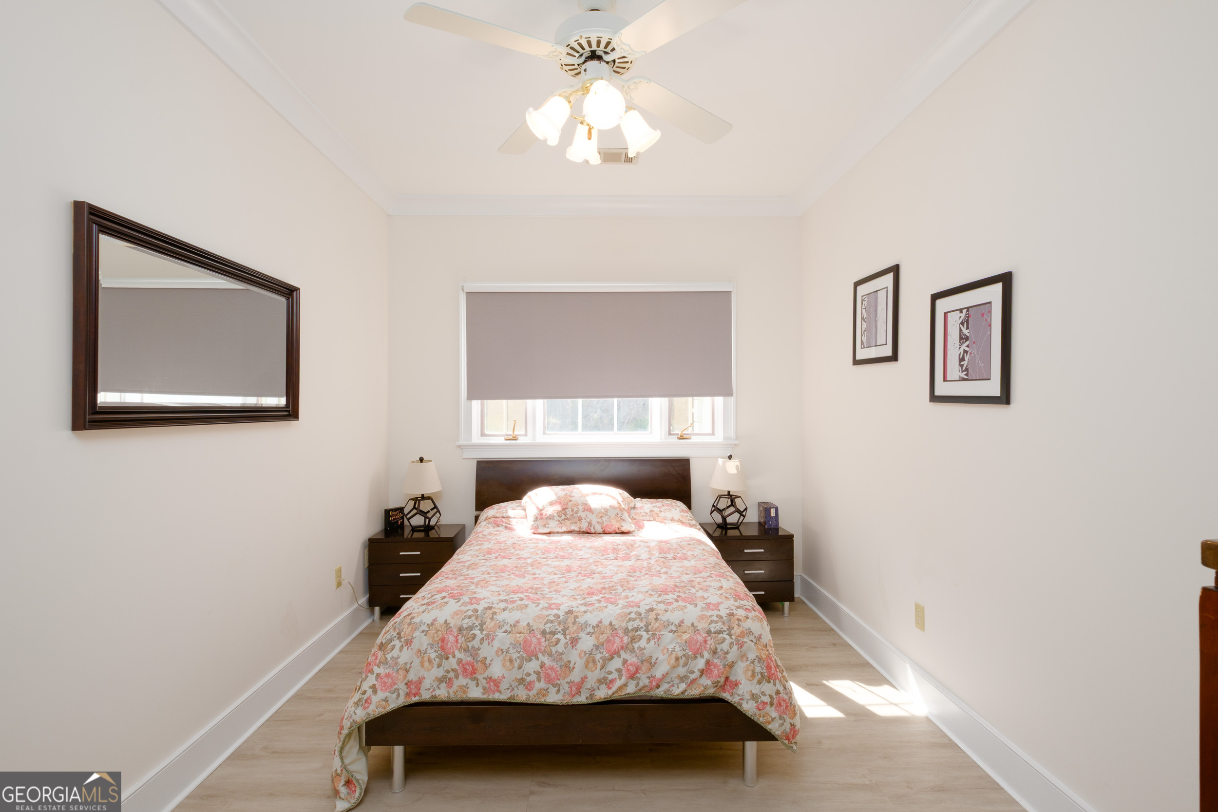 1900 Country Club Road Statesboro, GA 30458 - Photo 38 of 80 a bedroom with a bed and a chandelier