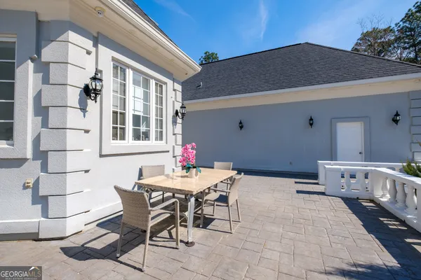 an aerial view of a house with swimming pool and outdoor space