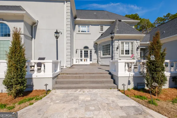 a view of a house with a snow in the yard