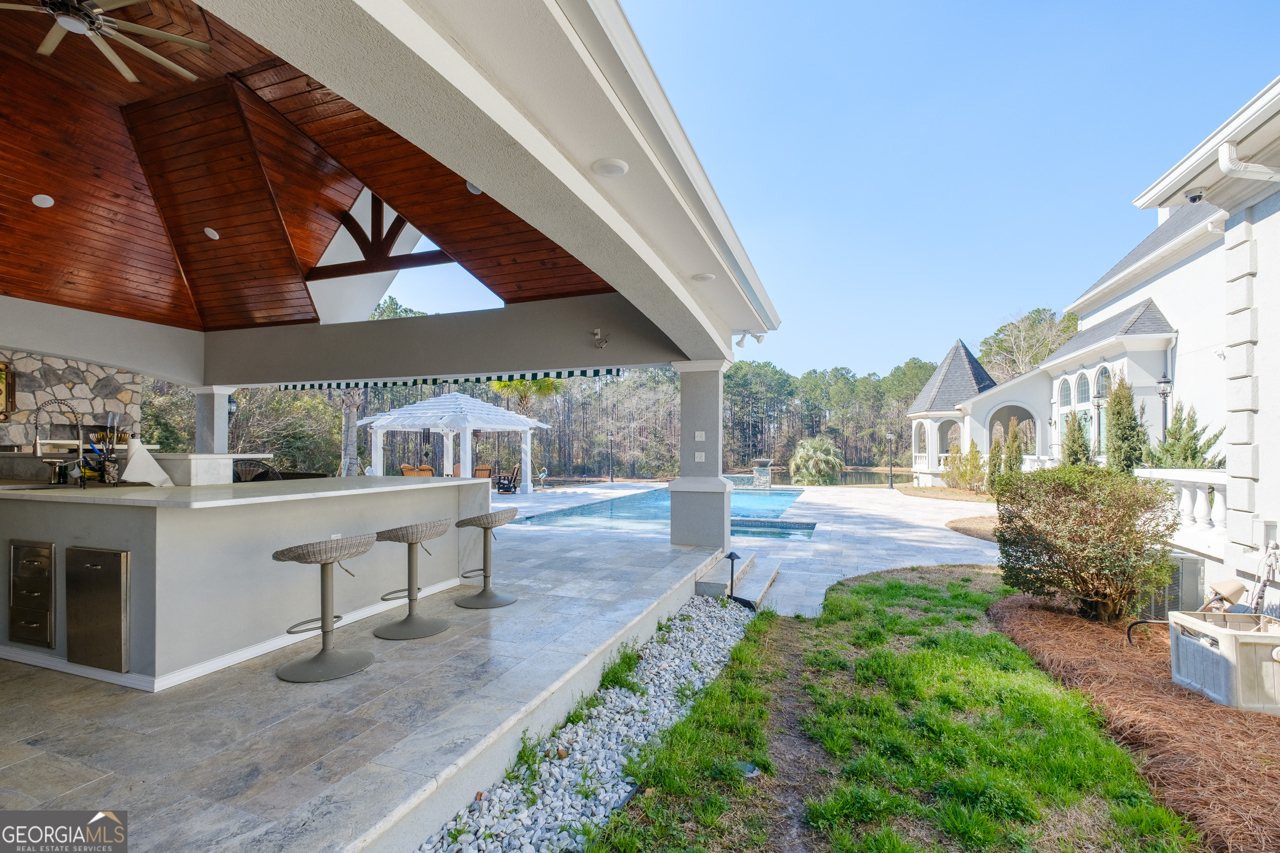 1900 Country Club Road Statesboro, GA 30458 - Photo 56 of 80 a view of a patio with table and chairs potted plants