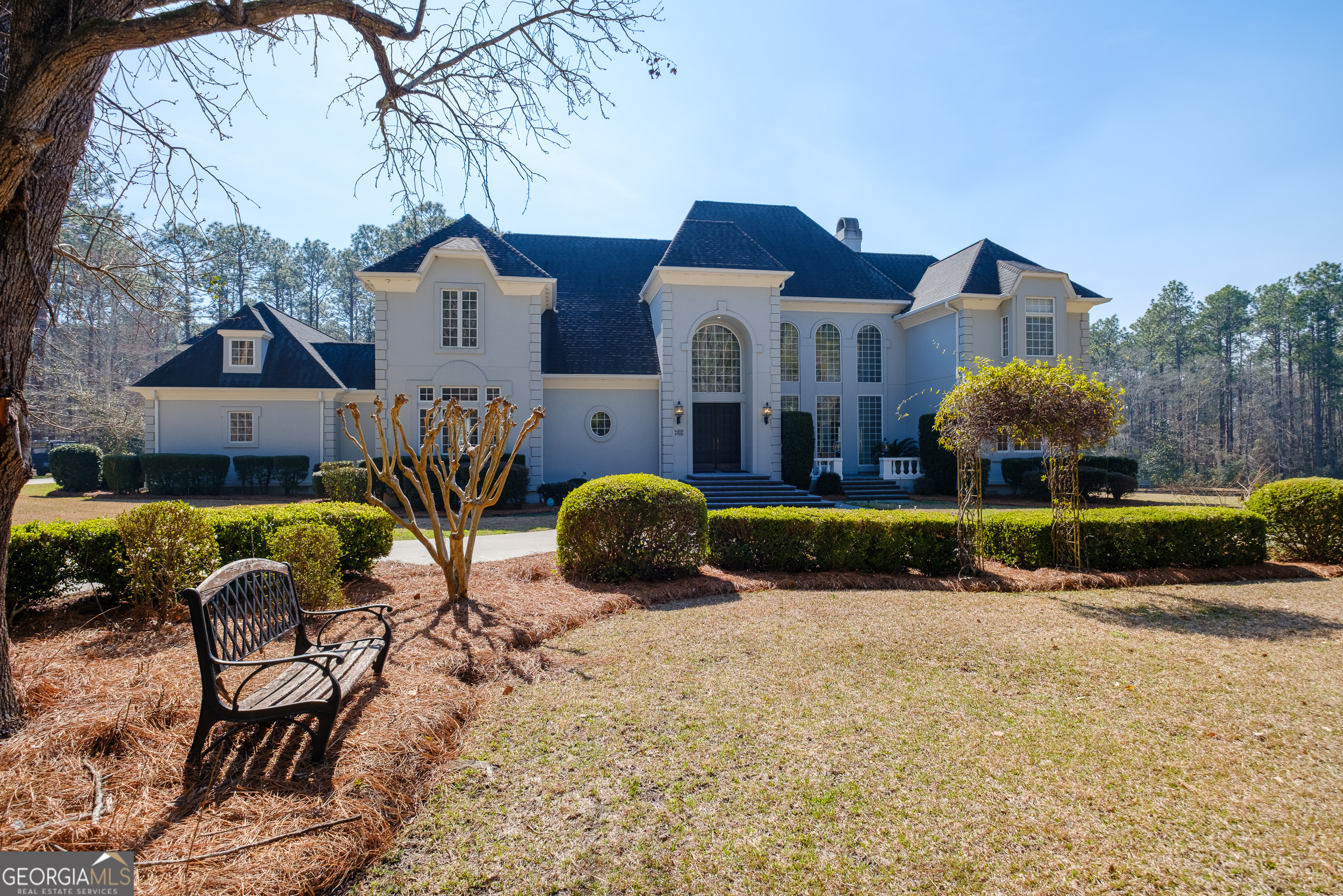 1900 Country Club Road Statesboro, GA 30458 - Photo 68 of 80 a front view of a house with a yard and garage