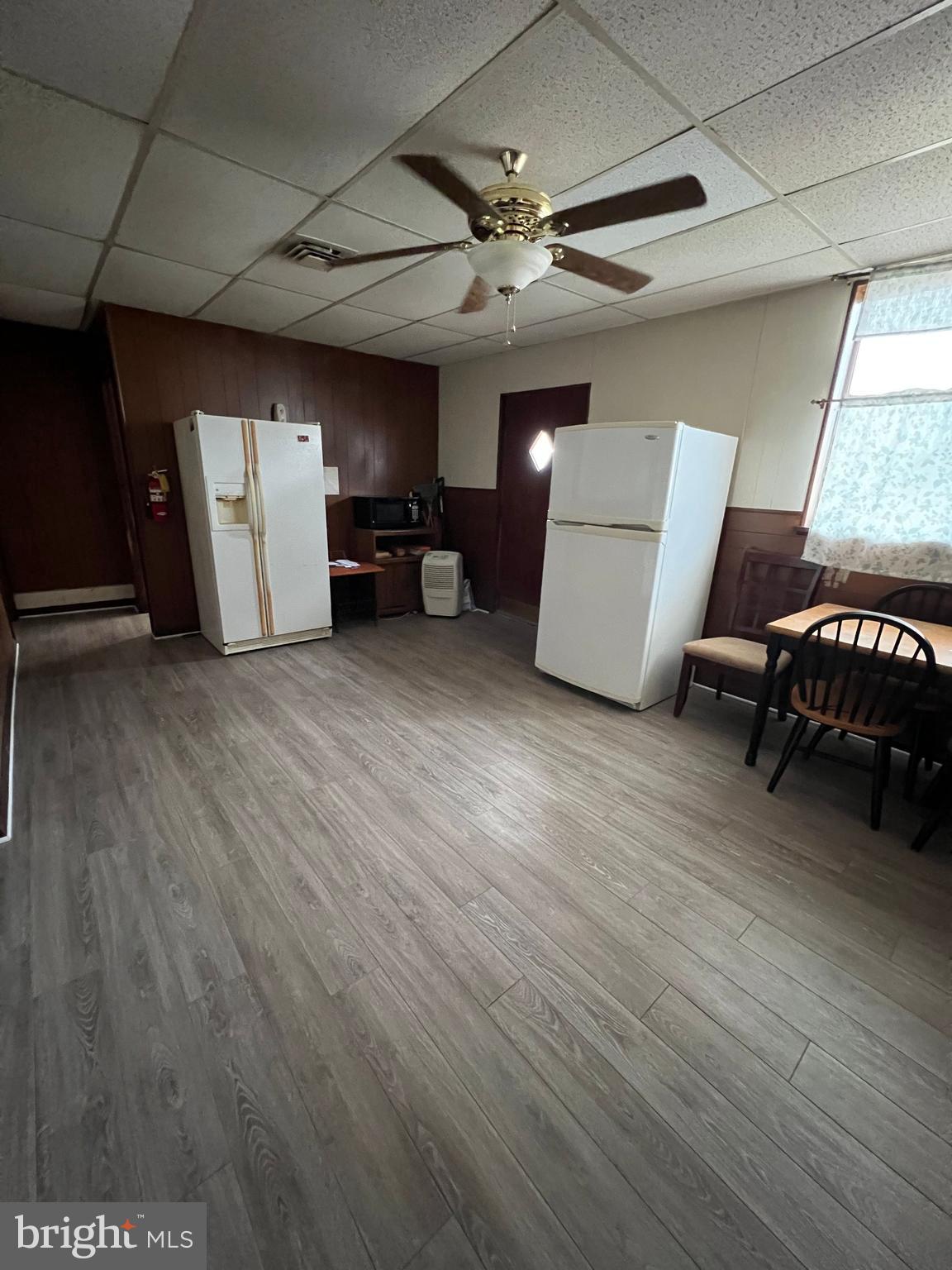 1100 Springdale Avenue York, PA 17403 - Photo 3 of 4 a view of a livingroom with a chair and a ceiling fan