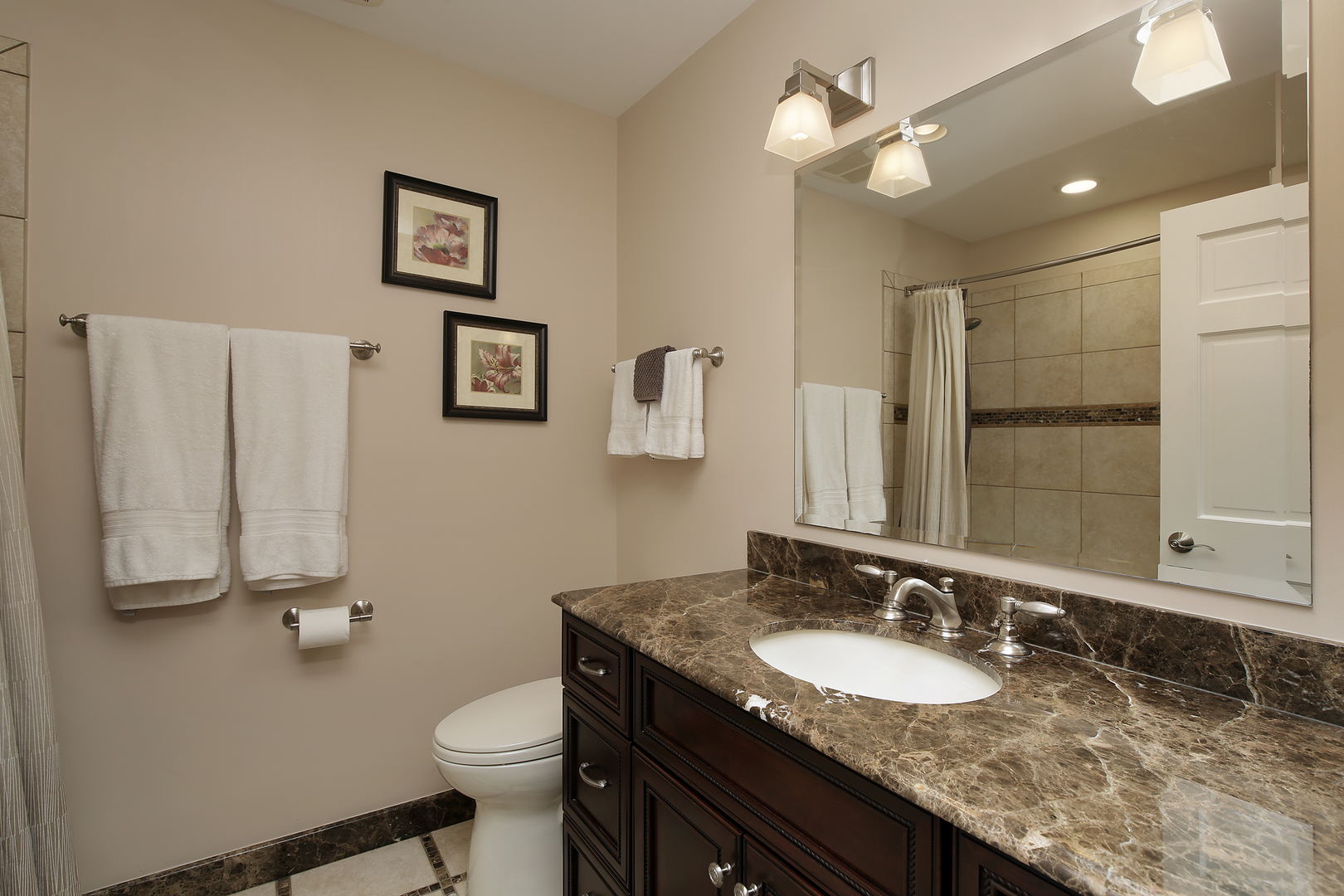 2040 Maplewood Road Northbrook, IL 60062 - Photo 15 of 30 a bathroom with a granite countertop sink a toilet and a mirror