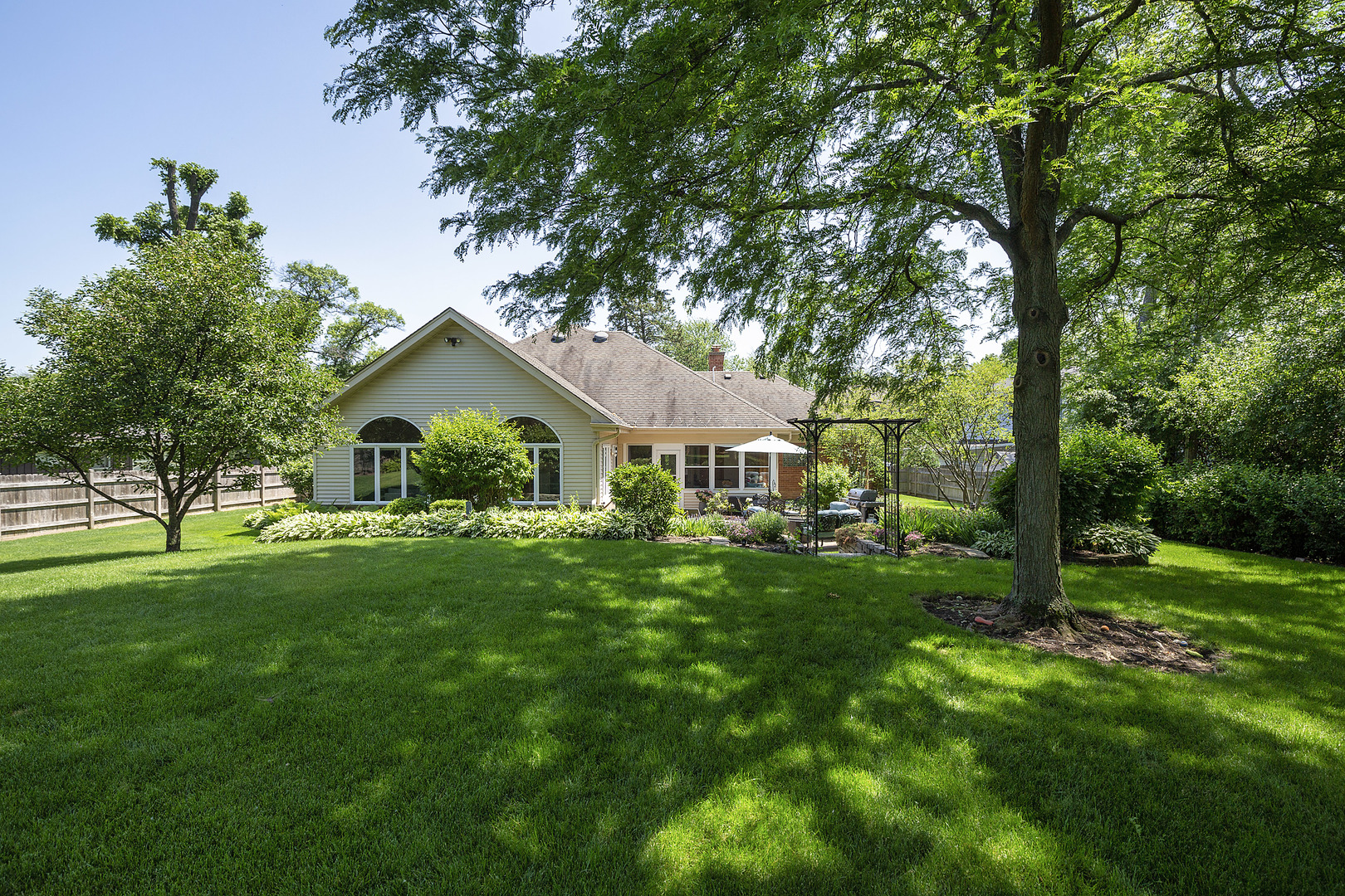 2040 Maplewood Road Northbrook, IL 60062 - Photo 27 of 30 a front view of a house with yard and green space