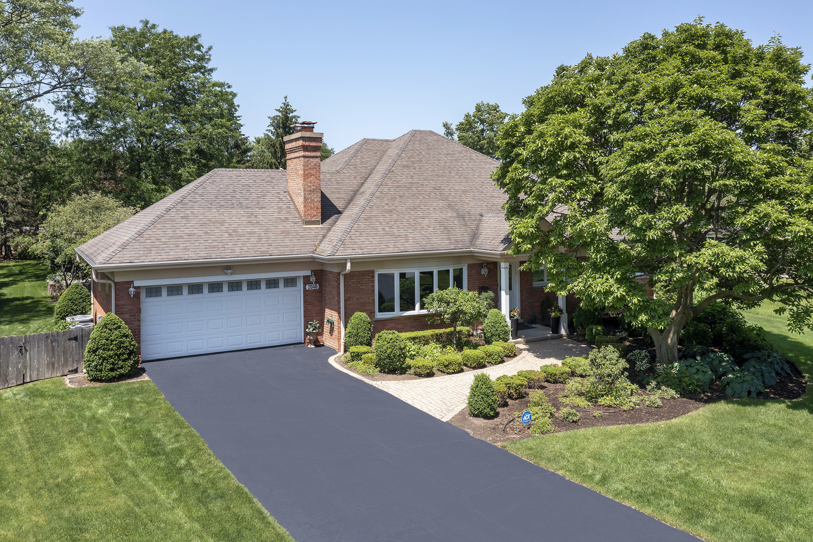 2040 Maplewood Road Northbrook, IL 60062 - Photo 3 of 30 a front view of a house with a yard