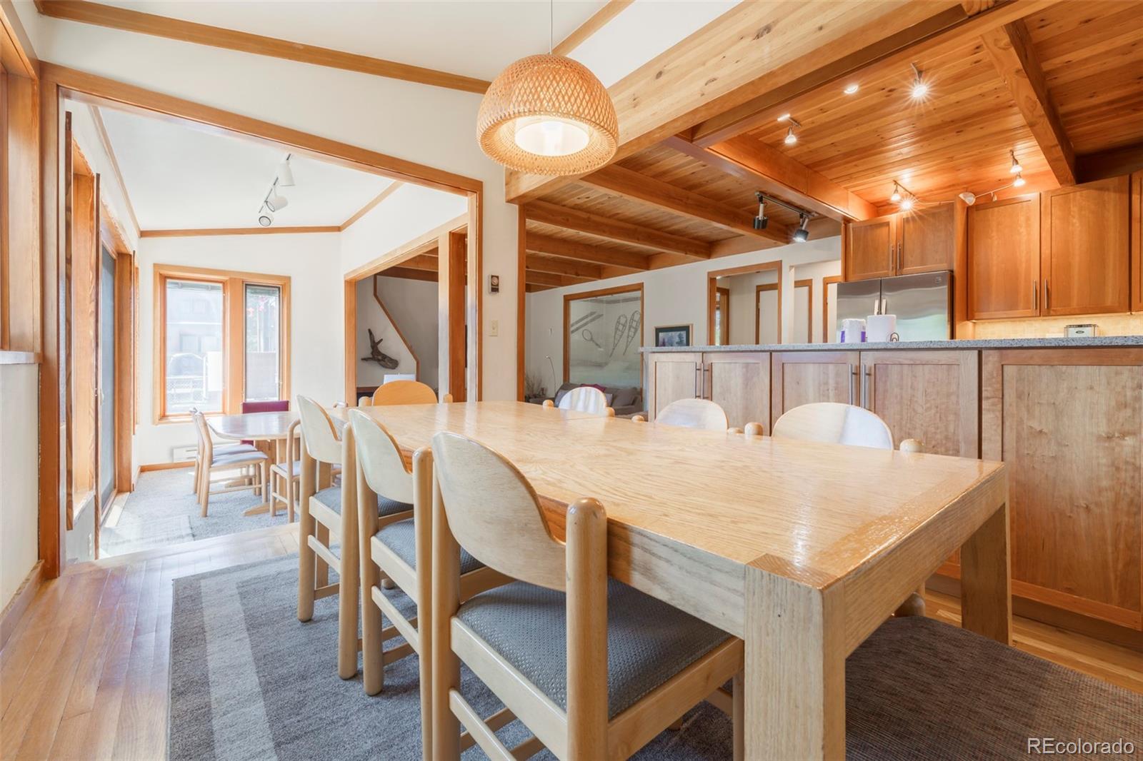 350 Tennis Club Road, Unit 1311 Dillon, CO 80435 - Photo 14 of 45 a view of a dining room with furniture and wooden floor