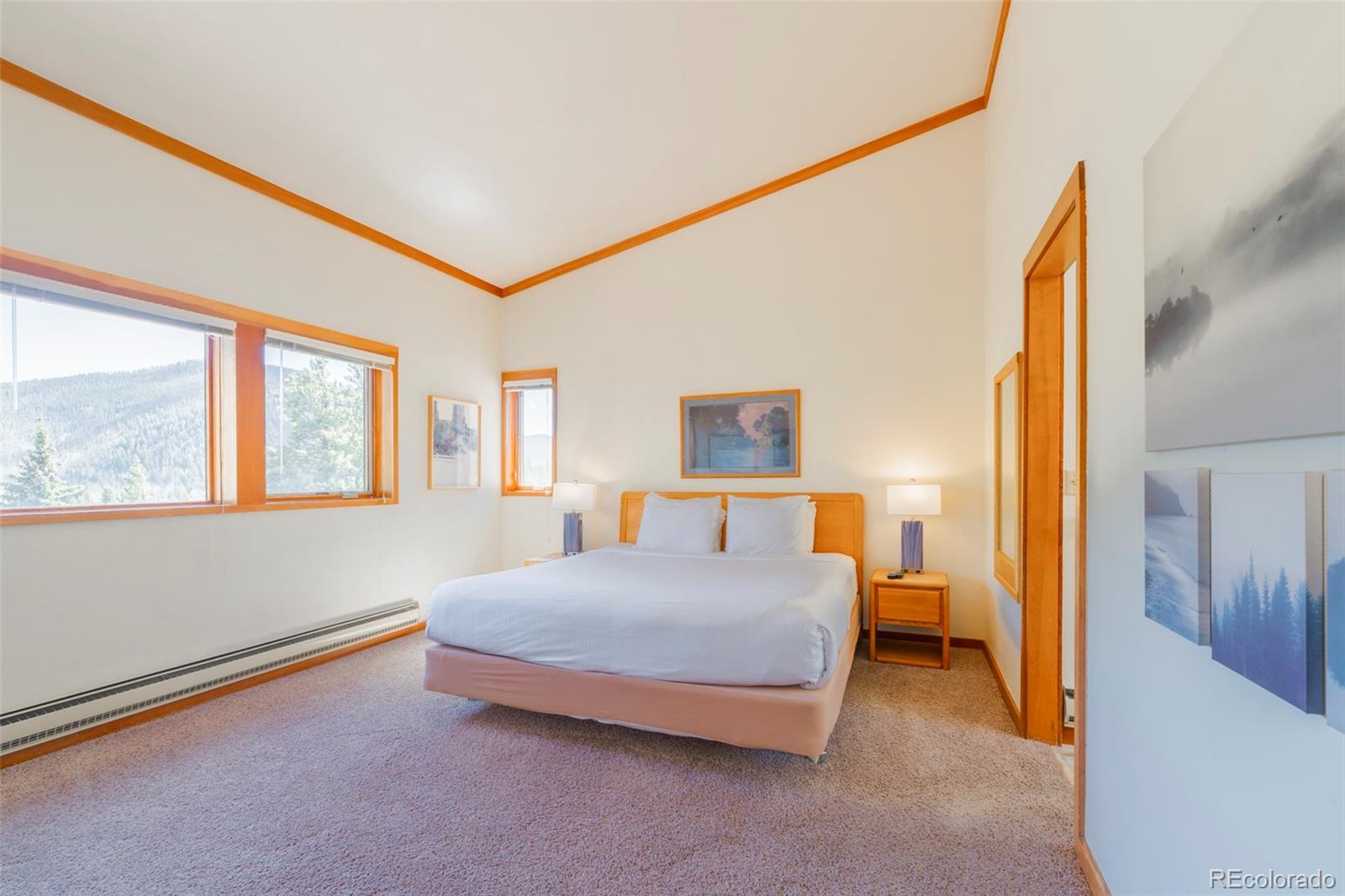 350 Tennis Club Road, Unit 1311 Dillon, CO 80435 - Photo 26 of 45 a bedroom with a bed and wooden floor