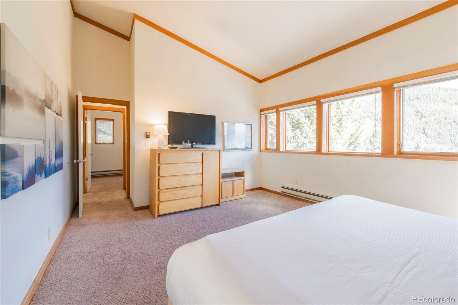 350 Tennis Club Road, Unit 1311 Dillon, CO 80435 - Photo 27 of 45 a bedroom with a bed and a flat screen tv