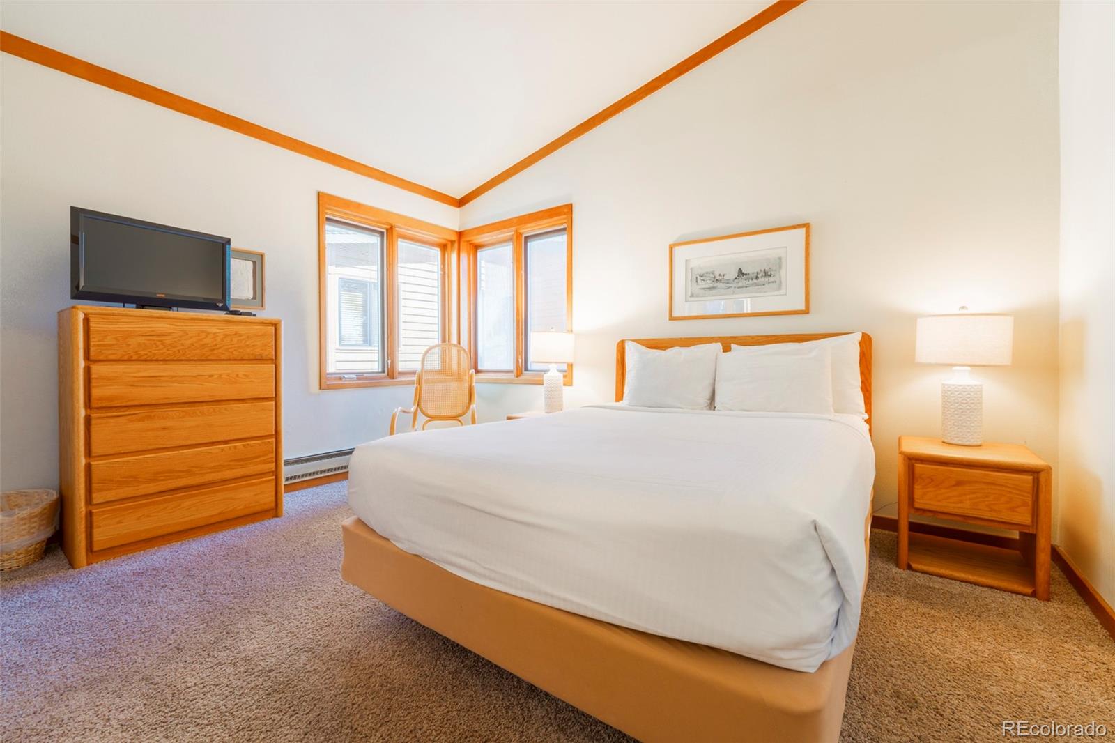 350 Tennis Club Road, Unit 1311 Dillon, CO 80435 - Photo 30 of 45 a bedroom with a bed and a television