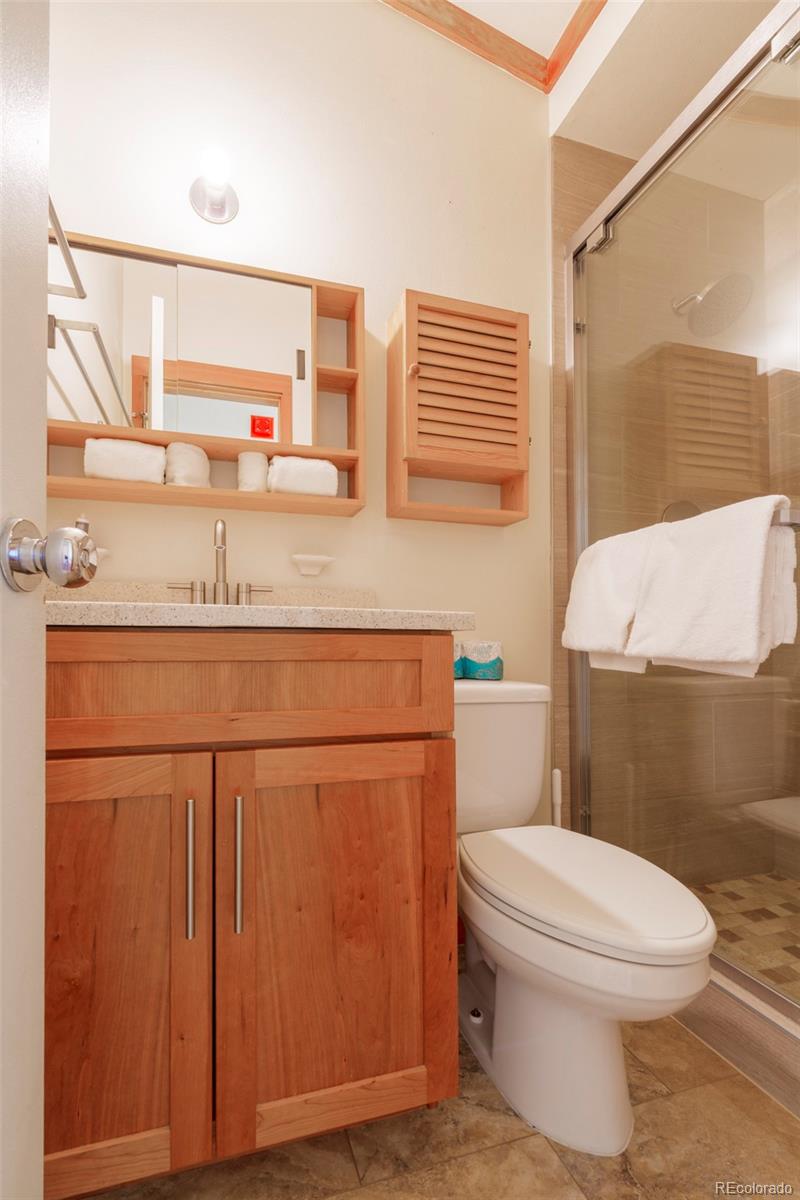 350 Tennis Club Road, Unit 1311 Dillon, CO 80435 - Photo 37 of 45 a bathroom with a sink a toilet and mirror