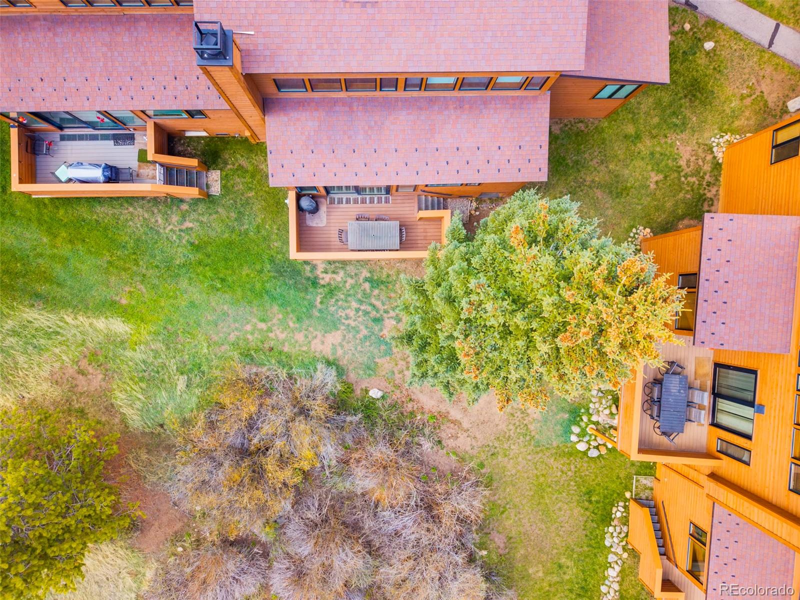 350 Tennis Club Road, Unit 1311 Dillon, CO 80435 - Photo 40 of 45 an aerial view of a house with a yard basket ball court and outdoor seating