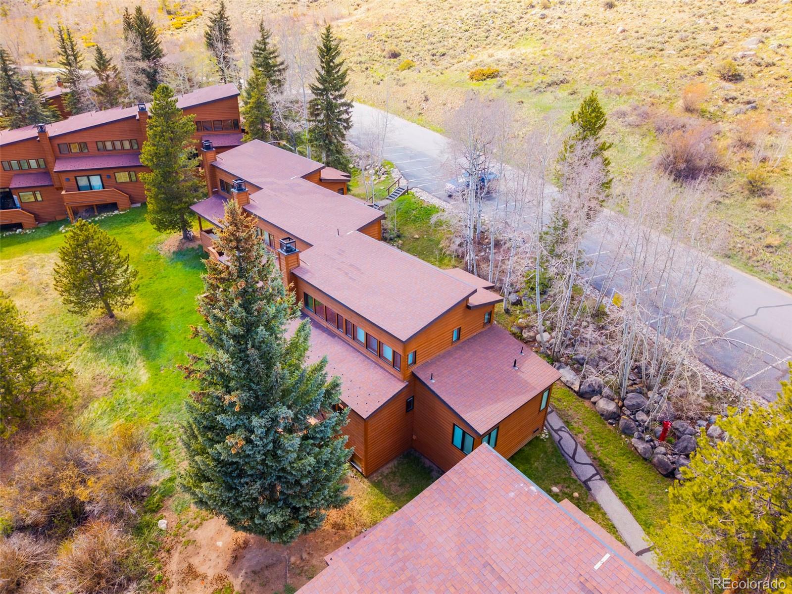 350 Tennis Club Road, Unit 1311 Dillon, CO 80435 - Photo 8 of 45 an aerial view of houses with yard