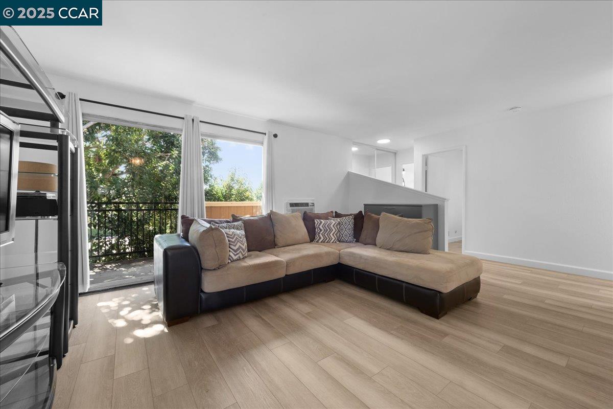 8975 Alcosta Boulevard, Unit 116 San Ramon, CA 94583 - Photo 10 of 31 a living room with furniture and a large window