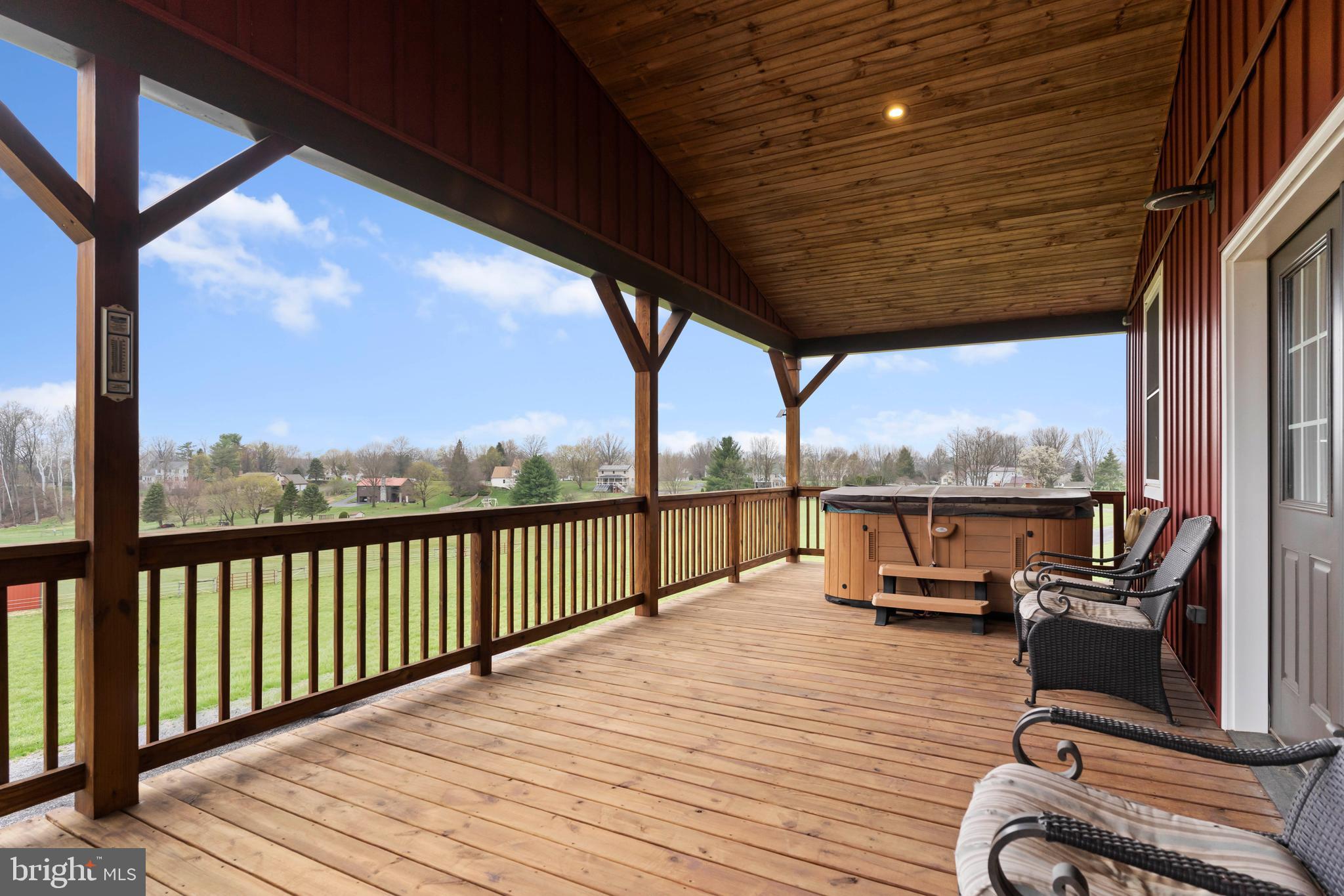 67 East Yellowbreeches Road Carlisle, PA 17015 - Photo 20 of 43 a view of a balcony with chairs and wooden floor