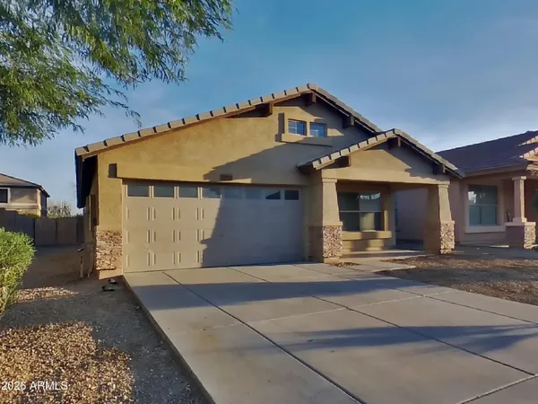 a front view of a house with a garage