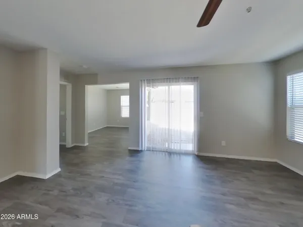 an empty room with wooden floor