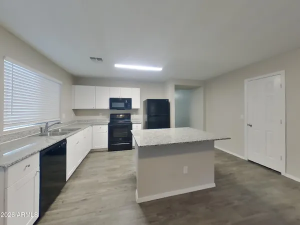 a view of livingroom with wooden floor