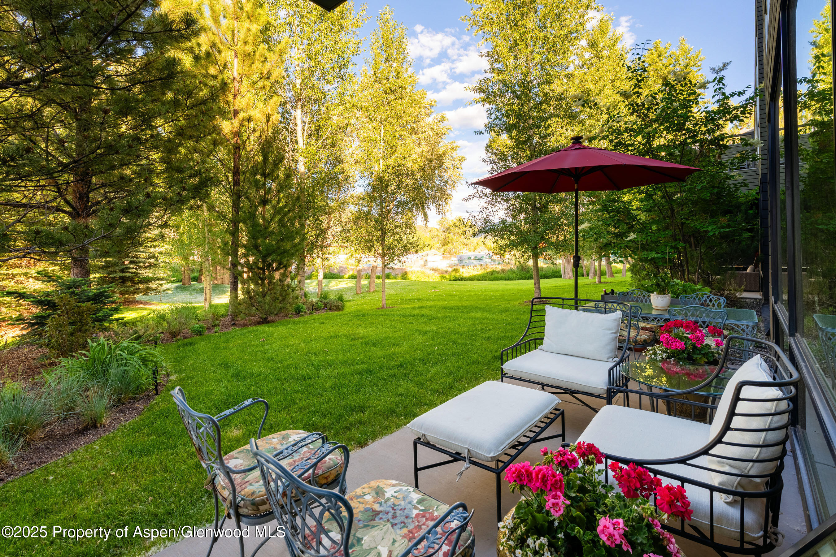 102 Evans Road, Unit 104 Basalt, CO 81621 - Photo 11 of 44 a view of a chairs and table in the garden