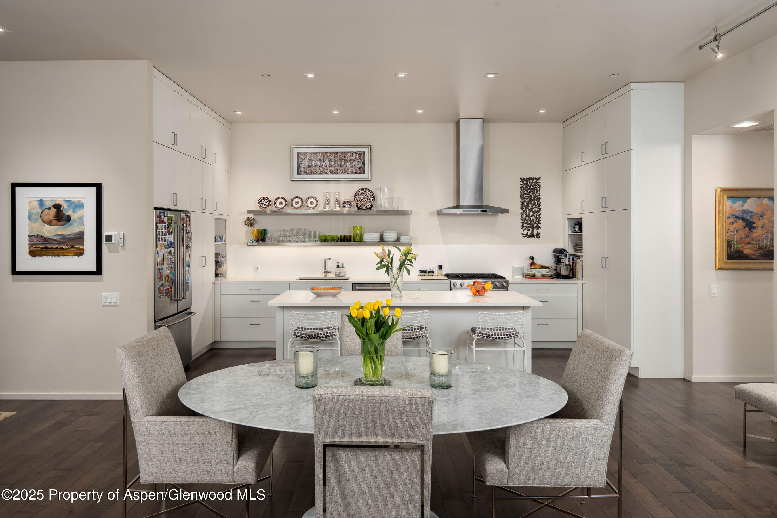 102 Evans Road, Unit 104 Basalt, CO 81621 - Photo 14 of 44 a kitchen with a dining table chairs and refrigerator