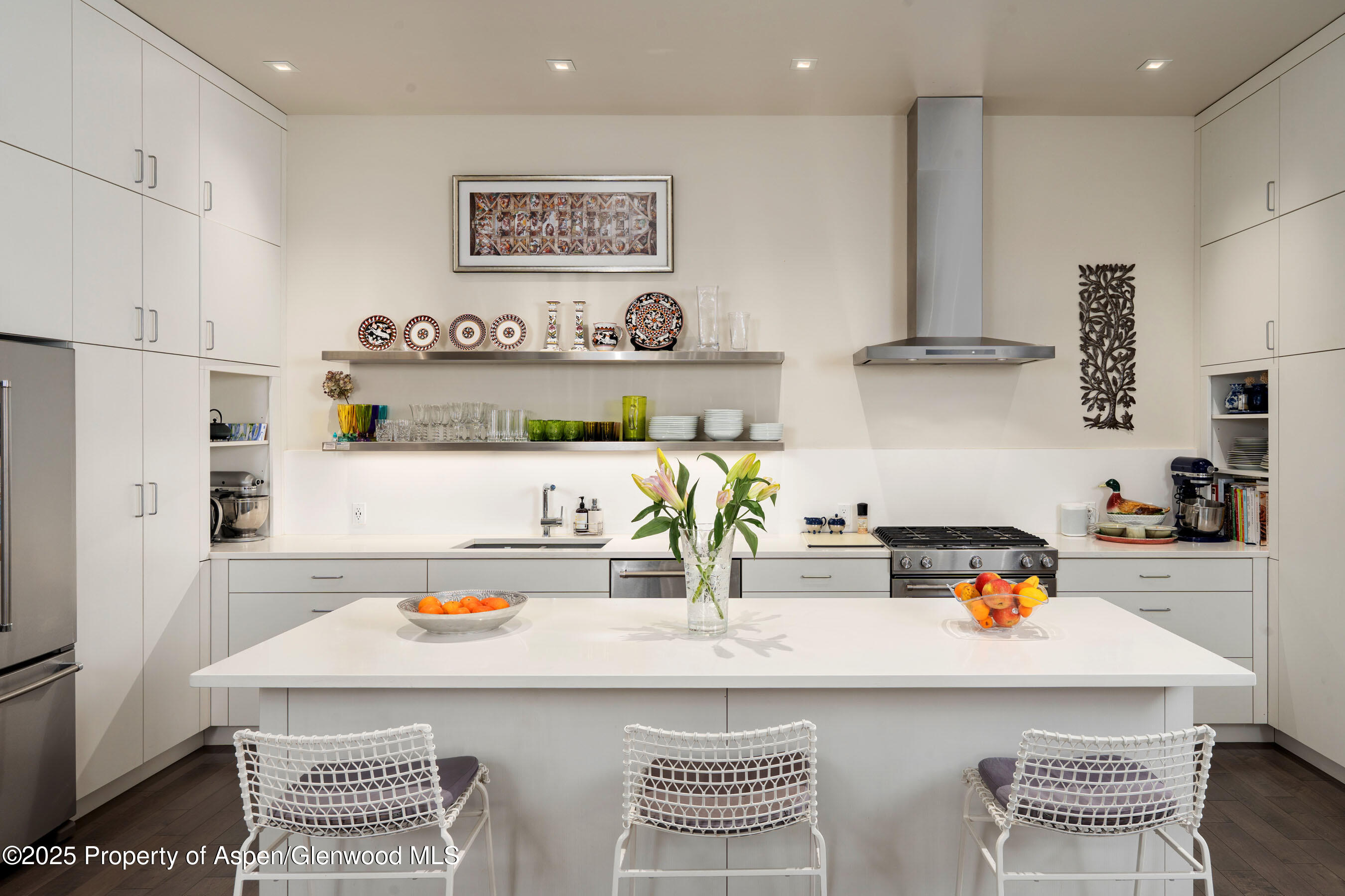 102 Evans Road, Unit 104 Basalt, CO 81621 - Photo 15 of 44 a kitchen with kitchen island a stove a sink and a refrigerator