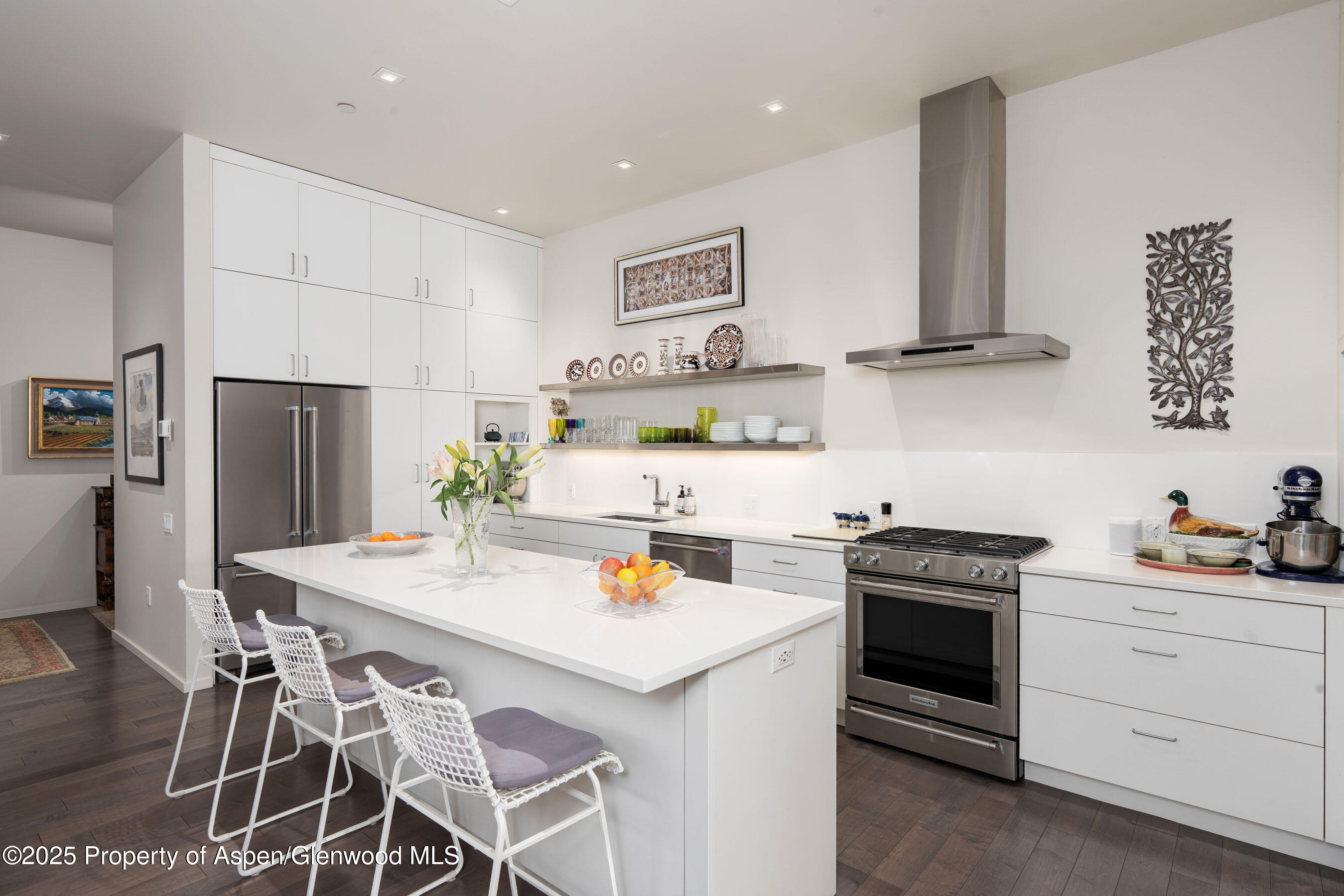 102 Evans Road, Unit 104 Basalt, CO 81621 - Photo 16 of 44 a kitchen with a stove a refrigerator and white cabinets