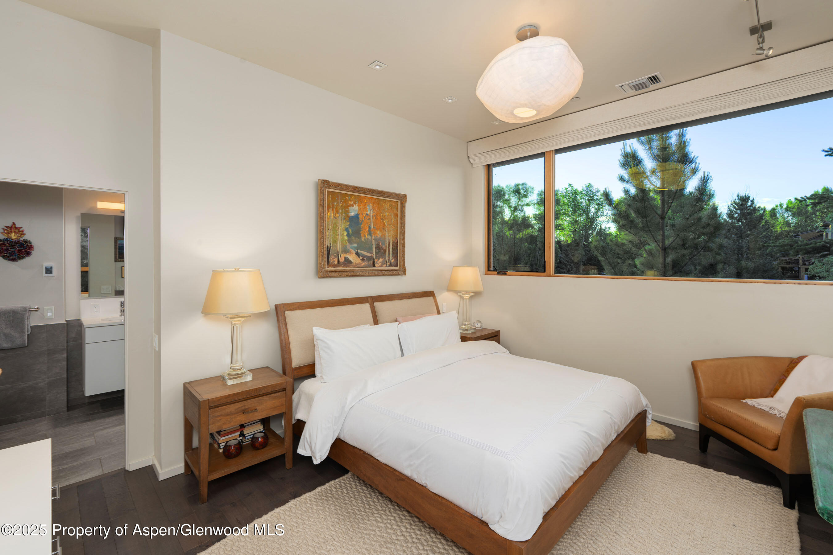 102 Evans Road, Unit 104 Basalt, CO 81621 - Photo 20 of 44 a bedroom with a bed and a large window