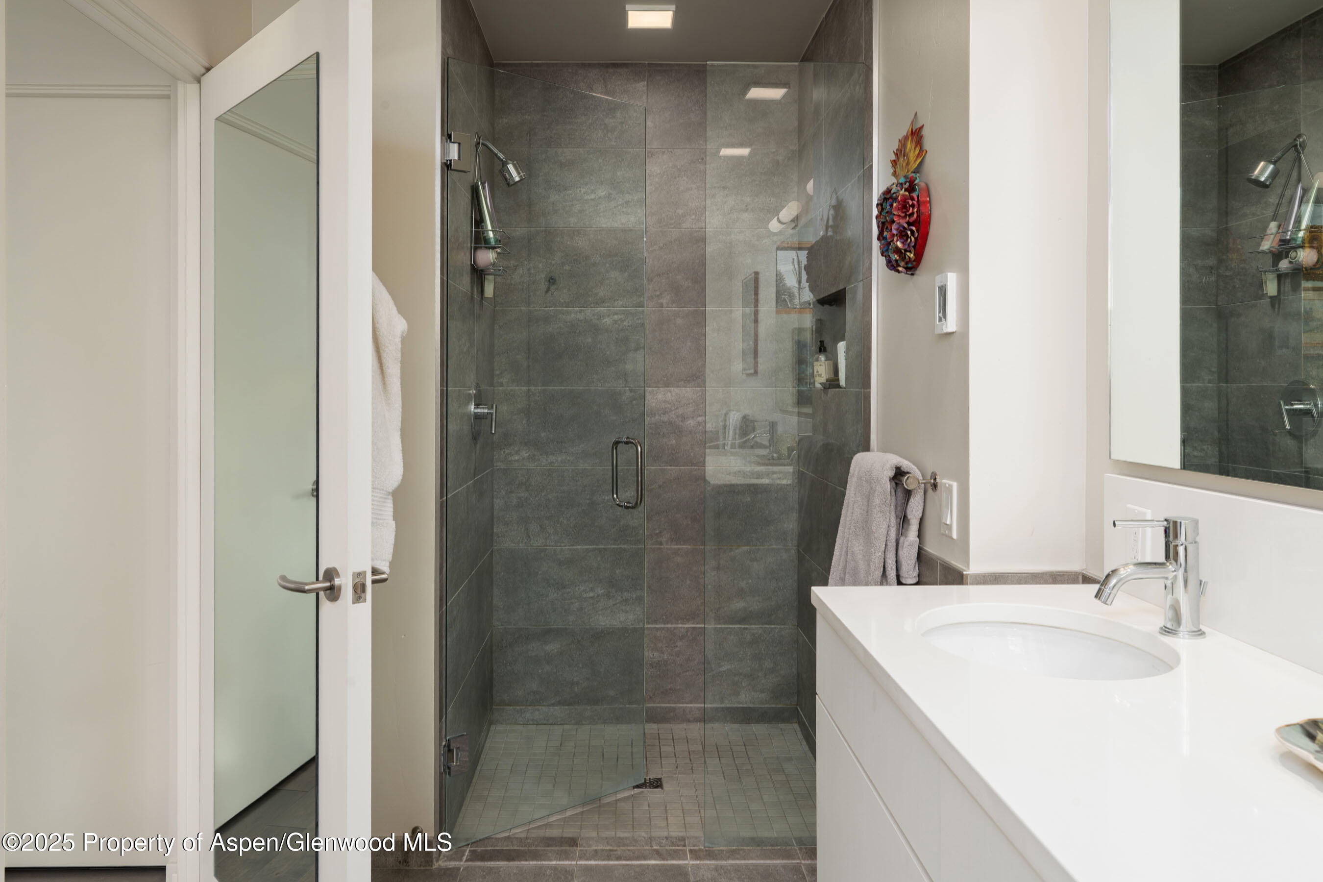102 Evans Road, Unit 104 Basalt, CO 81621 - Photo 24 of 44 a bathroom with a sink shower and a mirror