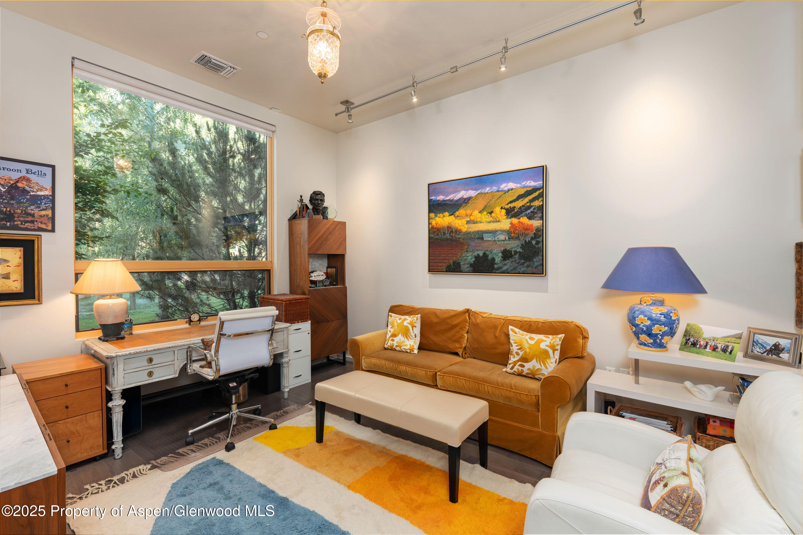 102 Evans Road, Unit 104 Basalt, CO 81621 - Photo 29 of 44 a living room with furniture a flat screen tv and a large window