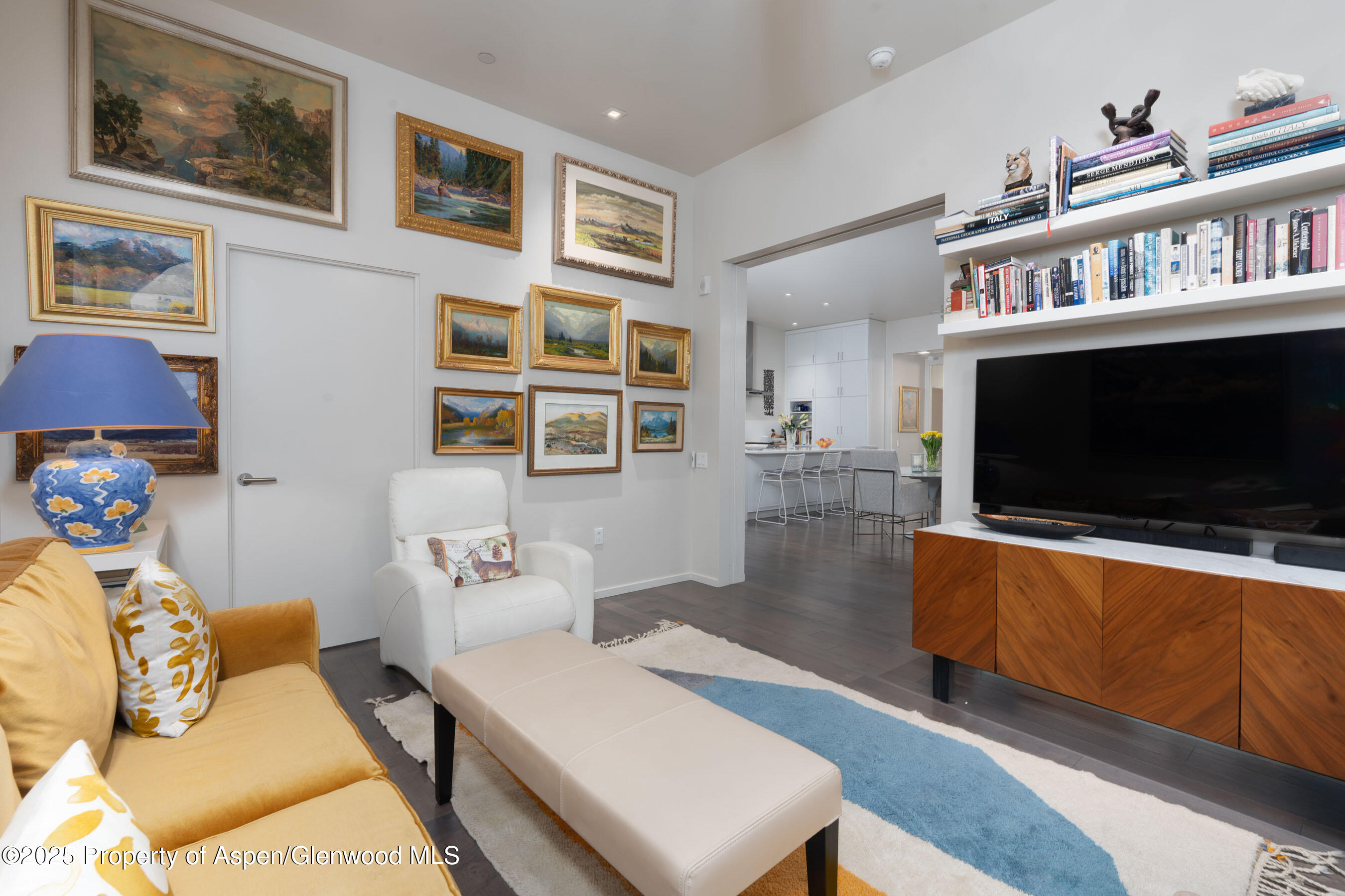 102 Evans Road, Unit 104 Basalt, CO 81621 - Photo 31 of 44 a living room with furniture and a flat screen tv