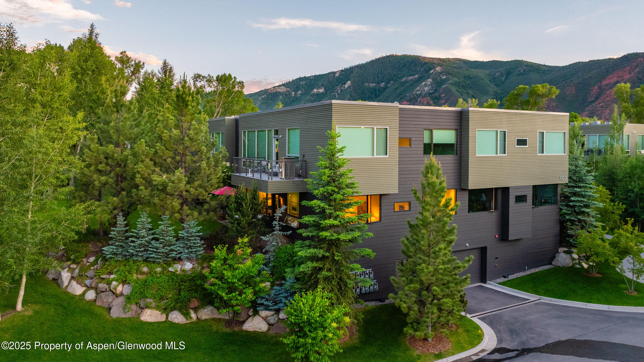 102 Evans Road, Unit 104 Basalt, CO 81621 - Photo 35 of 44 a front view of a house with a garden