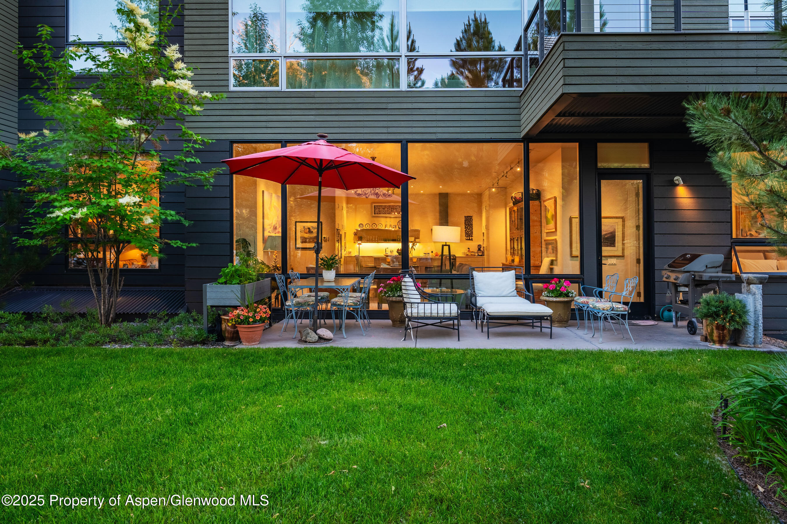 102 Evans Road, Unit 104 Basalt, CO 81621 - Photo 38 of 44 a view of a chairs and table in backyard of the house