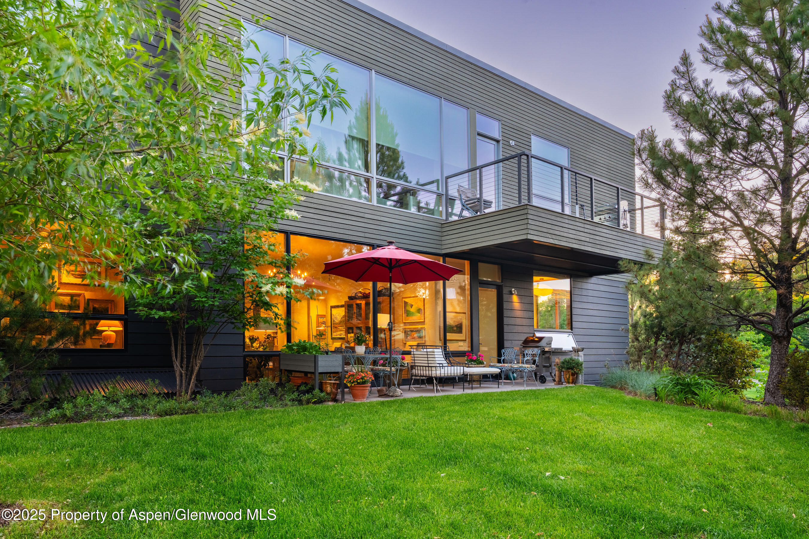 102 Evans Road, Unit 104 Basalt, CO 81621 - Photo 10 of 44 a view of a table and chairs in the back yard