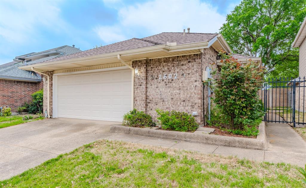 2602 Centaurus Drive Garland, TX 75044 - Photo 1 of 1 View of front of property featuring driveway, brick siding, a garage, and fence