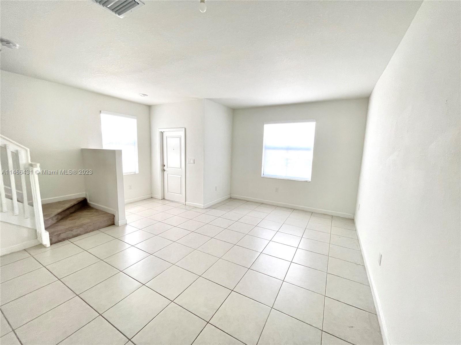 23373 Southwest 129th Path, Unit 23373 Miami, FL 33186 - Photo 11 of 20 a view of an empty room and window