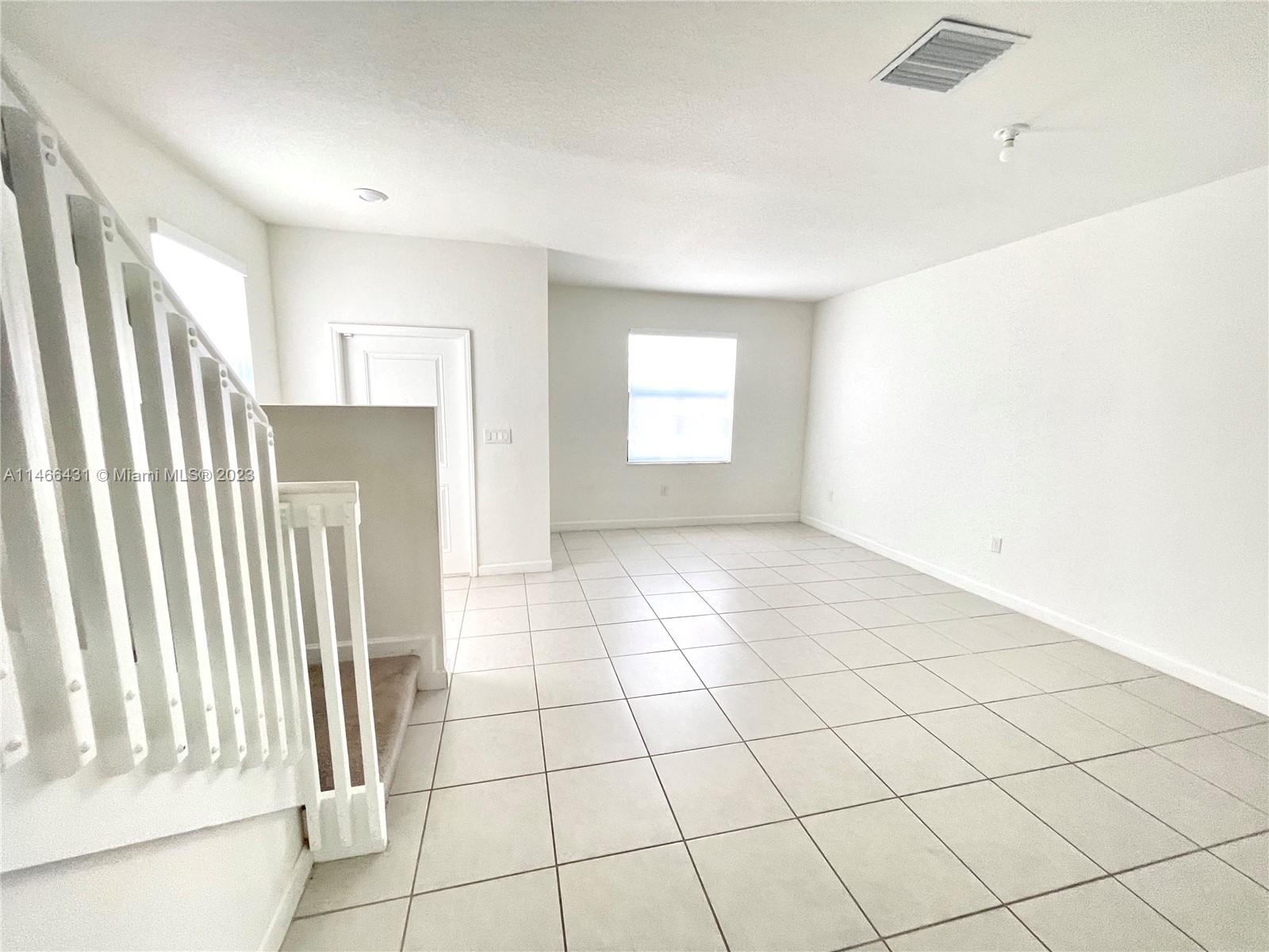 23373 Southwest 129th Path, Unit 23373 Miami, FL 33186 - Photo 12 of 20 a view of an empty room and window