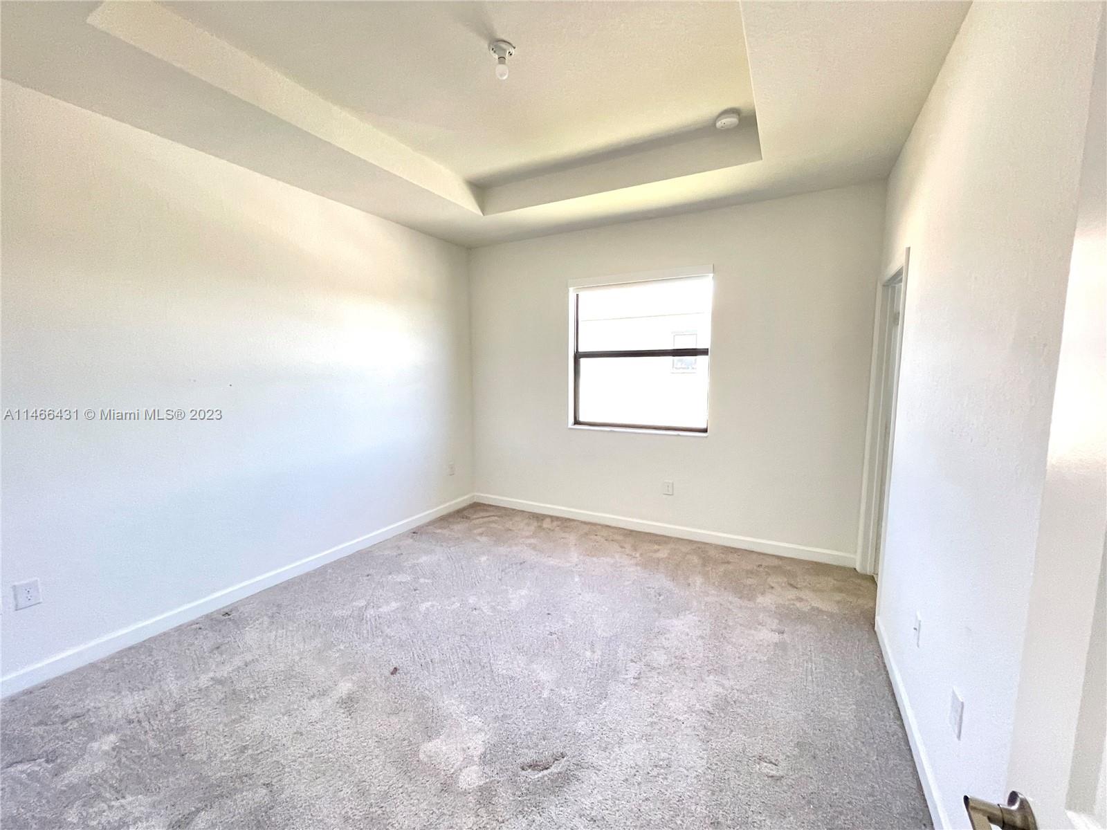 23373 Southwest 129th Path, Unit 23373 Miami, FL 33186 - Photo 13 of 20 an empty room with windows