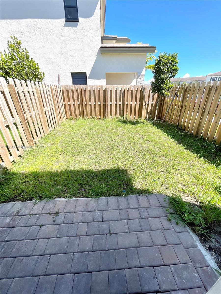 23373 Southwest 129th Path, Unit 23373 Miami, FL 33186 - Photo 18 of 20 a view of a garden