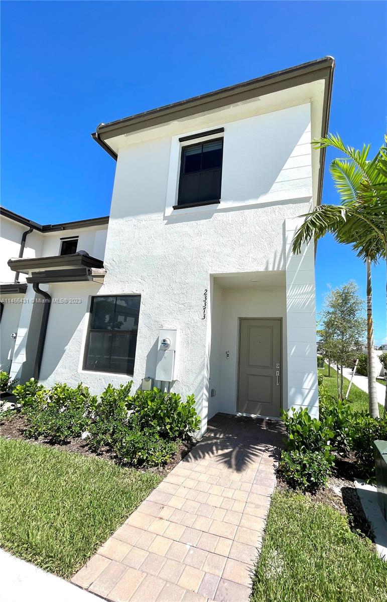 23373 Southwest 129th Path, Unit 23373 Miami, FL 33186 - Photo 3 of 20 a view of a house with a yard