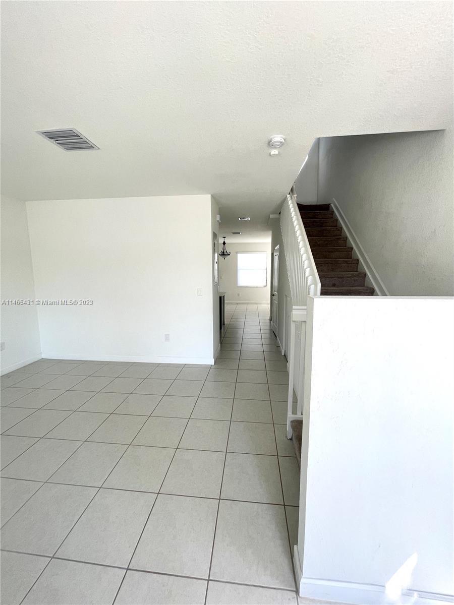 23373 Southwest 129th Path, Unit 23373 Miami, FL 33186 - Photo 5 of 20 a view of hallway with stairs