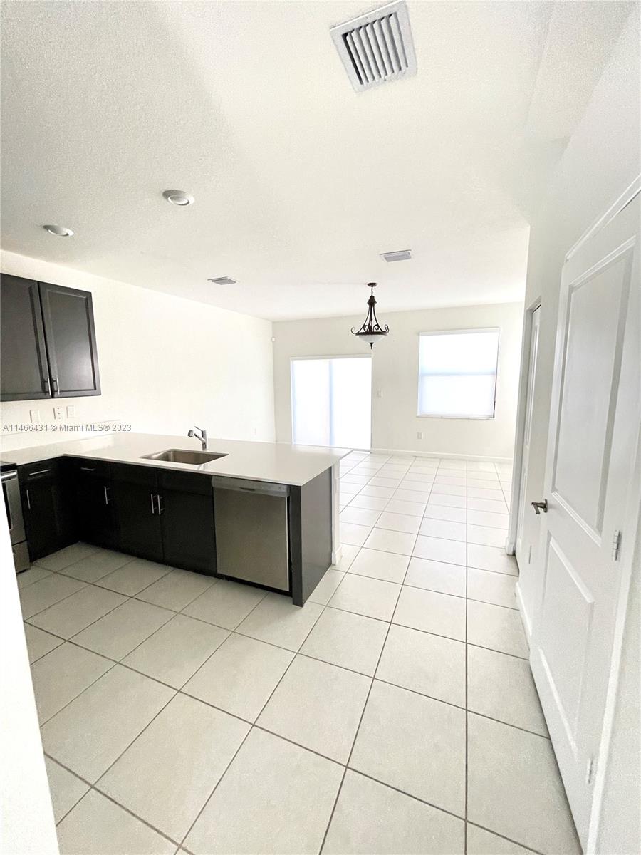 23373 Southwest 129th Path, Unit 23373 Miami, FL 33186 - Photo 6 of 20 a bathroom with a bathtub and a sink