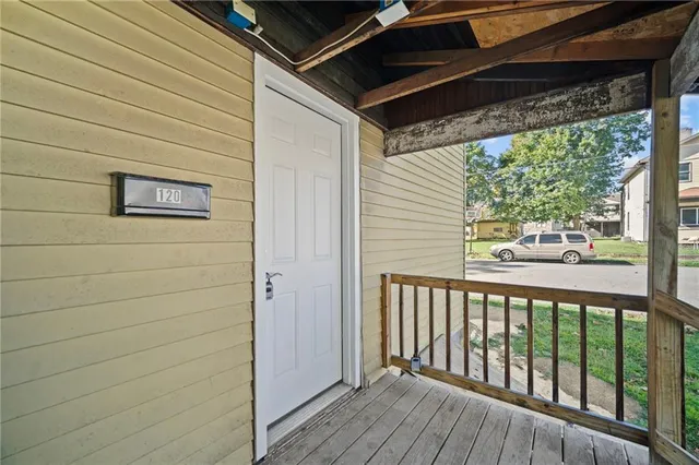 a view of a two chairs in the balcony