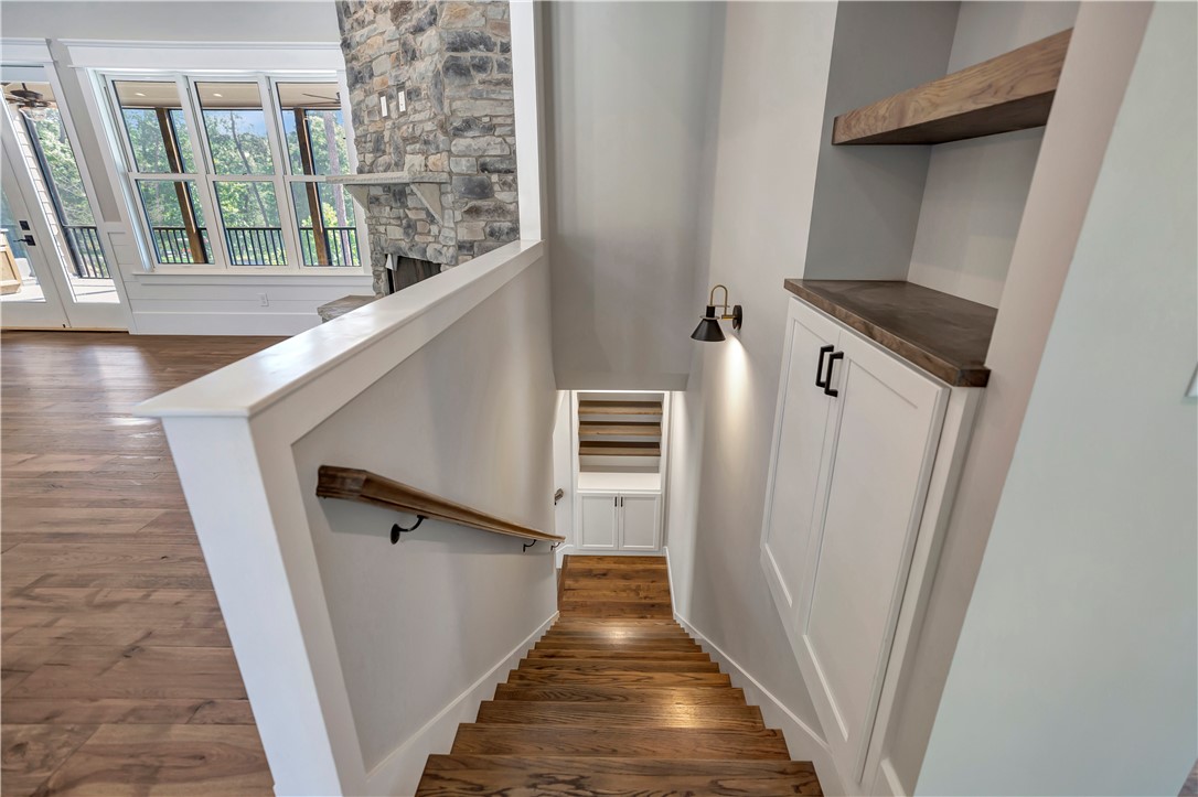 327 McAlister Road West Union, SC 29696 - Photo 26 of 45 Stairwell W/Two Bookcase/Shelving